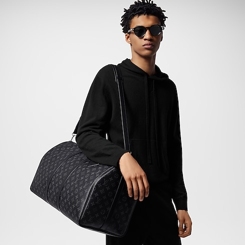 Keepall Bandoulière 55 Monogram Eclipse in Men's Travel Softsided Luggage and Duffle Bags collections by Louis Vuitton (Product zoom)