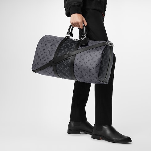 Keepall Bandoulière 50 Monogram Eclipse Canvas in Men's Travel Softsided Luggage and Duffle Bags collections by Louis Vuitton (Product zoom)