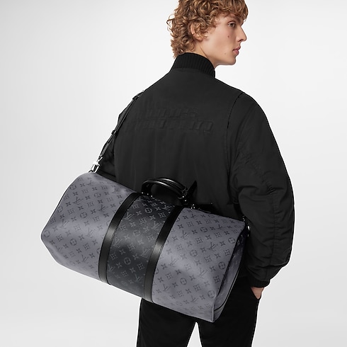 Keepall Bandoulière 50 Monogram Eclipse Canvas in Men's Travel Softsided Luggage and Duffle Bags collections by Louis Vuitton (Product zoom)