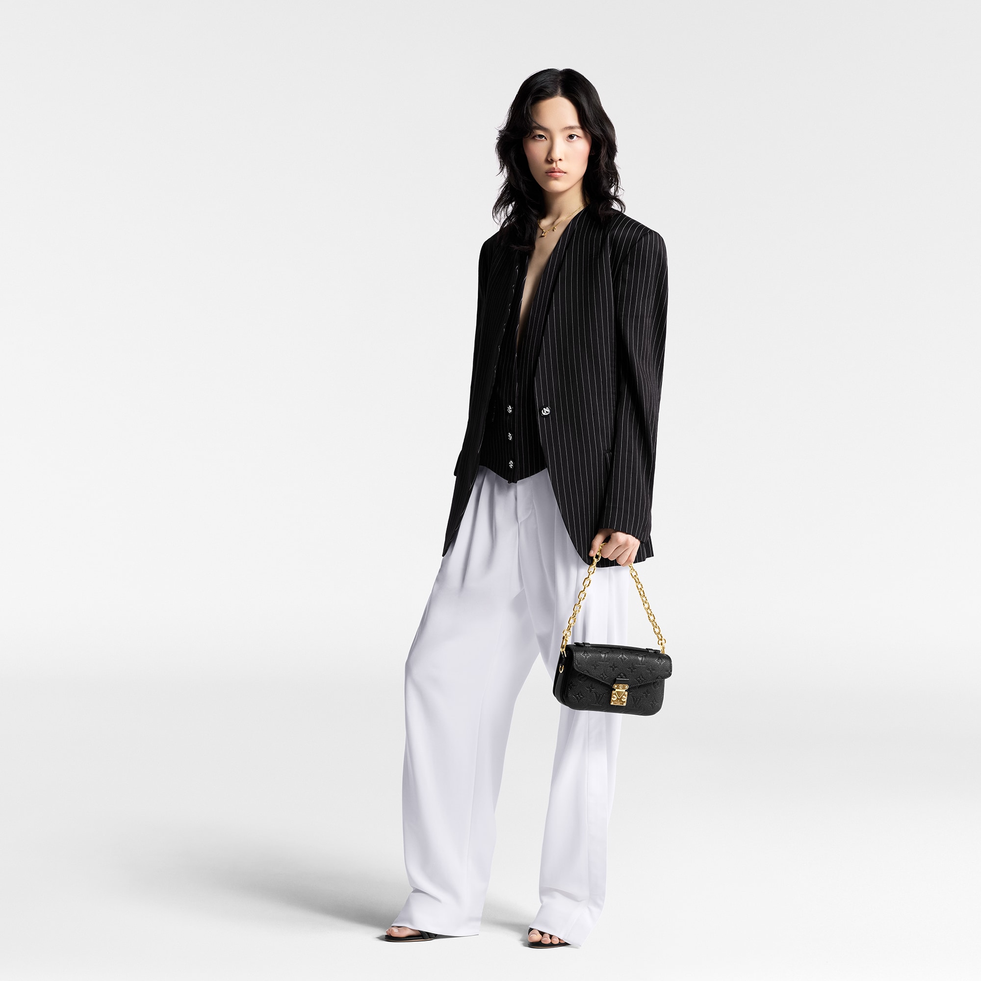 Pochette Métis East West Monogram Empreinte Leather in Women